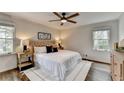 Bright bedroom featuring large windows, a ceiling fan and a neutral color scheme at 1450 Cedarhurst Dr, Dunwoody, GA 30338