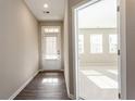 Bright entryway with wood floors, leading to a sunlit room at 4589 Hawthorn Rose Ln, Buford, GA 30518