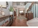 Open foyer with hardwood floors and staircase leading to the second level at 5111 Olive Branch Cir, Powder Springs, GA 30127