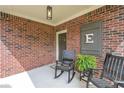 Cozy front porch with seating and stylish decor details at 5111 Olive Branch Cir, Powder Springs, GA 30127