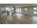 Modern kitchen with white cabinets, stainless steel appliances, and a stylish island at 517 Whitley Dr, Forest Park, GA 30297