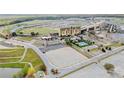 Aerial view of a condo community with expansive parking and easy access to the racetrack at 1500 Tara Pl # 709, Hampton, GA 30228