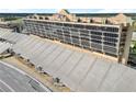 An exterior view of the condominium building near the speedway featuring expansive seating and lots of windows at 1500 Tara Pl # 709, Hampton, GA 30228
