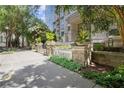 Condo exterior featuring manicured landscaping and 'The Paramount' signage at 3445 Stratford Ne Rd # 608, Atlanta, GA 30326