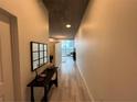 Hallway view with console table and mirror leading to a room with city views at 860 Peachtree Ne St # 2212, Atlanta, GA 30308