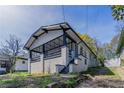 Craftsman home with covered front porch, painted brick foundation, and fresh landscaping at 1831 Jonesboro Se Rd, Atlanta, GA 30315