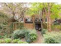 Charming brick townhome with lush landscaping and a private balcony, perfect for enjoying the outdoors at 105 Jefferson Cir, Sandy Springs, GA 30328