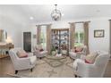 Bright and airy living room featuring hardwood floors, recessed lights, and stylish furnishings at 1254 Moores Mill Nw Rd, Atlanta, GA 30327