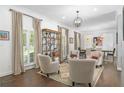 Open-concept living room with hardwood floors, natural light, and views to the dining area at 1254 Moores Mill Nw Rd, Atlanta, GA 30327