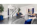 Stylish living room showing staircase, front door and dining area at 2560 Ashley Downs Ln, South Fulton, GA 30349