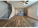 Bright and open living area flows into a modern kitchen with stainless steel appliances and an island at 6420 Olmadison Pl, Atlanta, GA 30349