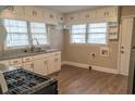 Well-lit kitchen with granite countertops and stainless-steel appliances at 8424 Taylor Rd, Riverdale, GA 30274
