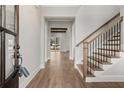 Open foyer showcases hardwood floors, staircase, and views into the expansive living space beyond at 3812 Havenrock Dr, Marietta, GA 30066