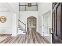 Bright foyer with staircase, hardwood floors, and an open design at 2516 Woolwich Nw Ct, Acworth, GA 30101