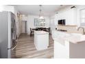 Bright eat-in kitchen with stainless refrigerator and ample cabinet space at 2516 Woolwich Nw Ct, Acworth, GA 30101