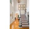 Grand foyer with high ceilings, staircase, hardwood floors, and natural light from large windows at 978 Moores Club Ne, Atlanta, GA 30319