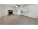 Inviting living room highlighting a stone fireplace, open layout, and abundant natural light at 31 Fox Creek Ct, Dallas, GA 30157