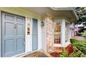 Charming home entrance with a blue front door, stone steps, and a brick facade at 993 Castle Falls Dr. Ne Dr, Atlanta, GA 30329