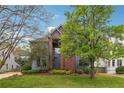 Beautiful two-story home with brick accents, mature landscaping, and a welcoming entrance at 108 Kirk Crossing Dr, Decatur, GA 30030