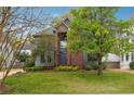 Inviting home with lush greenery, a well-maintained lawn, and a classic brick facade at 108 Kirk Crossing Dr, Decatur, GA 30030