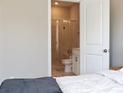 Bedroom view into bathroom with sleek glass shower and modern fixtures, offering a private retreat at 308 Overture Ct, Smyrna, GA 30080
