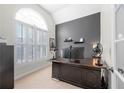 Bright office space with large window, vaulted ceiling, built-in shutters and neutral decor at 3285 Millwood Se Trl, Smyrna, GA 30080