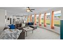 Bright and open living room with a wall of windows, and an adjacent kitchen at 3048 Level Grove Ln, Dacula, GA 30019