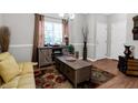Charming living room with decorative rug, window, couch, and cabinet with adjacent storage at 1731 Pryor Sw Rd # 108, Atlanta, GA 30315
