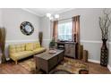 Cozy living room featuring decor, rug, natural lighting, cabinet, and comfortable seating at 1731 Pryor Sw Rd # 108, Atlanta, GA 30315