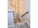 Carpeted staircase with decorative wall art, creating a warm and inviting atmosphere at 1731 Pryor Sw Rd # 108, Atlanta, GA 30315
