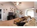 Cozy living room with vaulted ceilings, a ceiling fan, and neutral tones for a comfortable and inviting space at 531 Lindsey Way, Social Circle, GA 30025