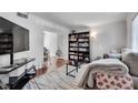 Cozy living room featuring a sofa, shelving and natural light at 6940 Roswell Rd # 5B, Atlanta, GA 30328