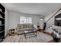 Bright living room with a comfortable sofa and large windows at 6940 Roswell Rd # 5B, Atlanta, GA 30328