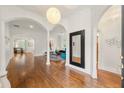 Elegant foyer boasting hardwood floors, arched doorways, and stylish decor creates a welcoming atmosphere at 1079 Arbor Ne Trce, Atlanta, GA 30319