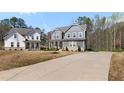 Exterior view of two homes featuring long driveways, nicely manicured landscapes and classic, stylish architecture at 29 Laurelwood Nw Ln, Cartersville, GA 30121