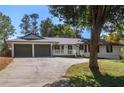 Inviting home with a neatly maintained front yard and a convenient two-car garage at 1025 Martins Lake Close, Roswell, GA 30076