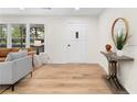 Bright foyer with wood-look floors, a white front door, and tasteful decor at 2405 Clifton Springs Rd, Decatur, GA 30034