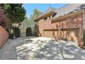 Brick home with a two-car garage, an outdoor basketball hoop, and a spacious driveway in a verdant setting at 4215 Homestead Ridge Dr, Cumming, GA 30041