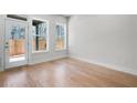A naturally lit, vacant room with hardwood floors, ready to be transformed into your personal space at 2572 Silver Star Ne Dr, Marietta, GA 30066
