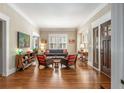 Spacious living room featuring hardwood floors, natural light, and comfortable seating areas by the front door at 637 Linwood Ne Ave, Atlanta, GA 30306