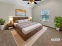 Cozy staged main bedroom with a ceiling fan, natural light, and minimalist decor at 120 Madison Grace Ave, Mcdonough, GA 30252