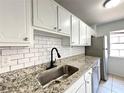 Kitchen with granite countertops, stainless steel appliances, and matte black faucet at 3156 Nectarine Cir, Decatur, GA 30034