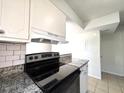 Close up of the new black range stove and countertops at 3156 Nectarine Cir, Decatur, GA 30034