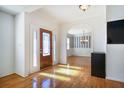 Bright foyer with hardwood floors, and decorative glass front door at 2223 Jay Se Ln, Smyrna, GA 30080