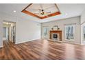 Spacious living room featuring a decorative ceiling, fireplace, and wood-look flooring at 302 Vinson Mountain Loop, Rockmart, GA 30153