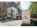 Stunning modern townhome exterior with brick and black trim, located in the vibrant 28th at Brookwood community at 1821 Huntington Hills Nw Ln, Atlanta, GA 30309