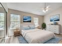 Comfortable bedroom featuring generous natural light and a ceiling fan at 2306 Queen Anne Ct, Atlanta, GA 30350