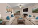 Inviting living room with fireplace, hardwood floors, and access to the kitchen at 2306 Queen Anne Ct, Atlanta, GA 30350
