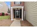 Charming front entrance featuring a black door with decorative glass and white columns at 4248 Brighton Nw Way, Kennesaw, GA 30144