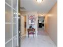 Inviting entryway with light tile floors, leading to living area and other rooms at 8166 N Pine Cone Dr, Villa Rica, GA 30180
